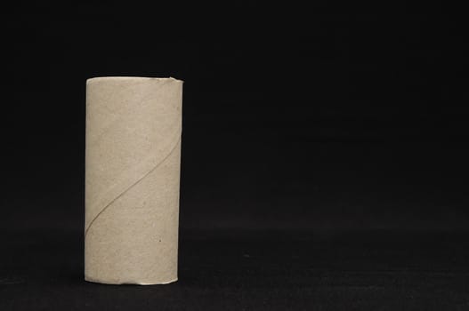 Empty Toilet Rolls Stack Up On a Black Background