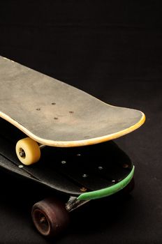 Vintage Style Black Skateboard on a black Background