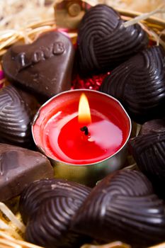 candle at center of home made chocolates