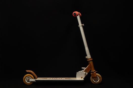 Metal scooter for child on white background