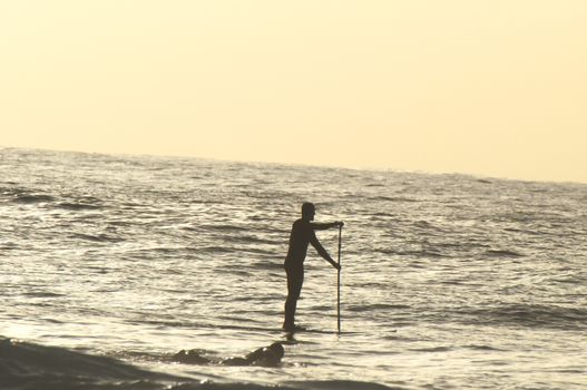 Silhouette Surfer Riding a Big Wave in Tenerife Canary Island Spain