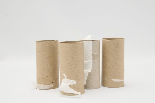 Empty Toilet Rolls Stack Up On a Black Background