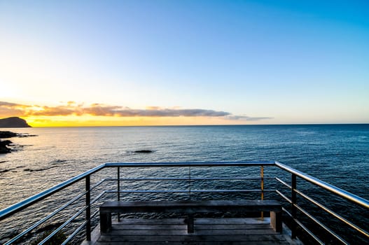 Sunrise on a Pier over Atlantic Ocean in Tenerife Canary Islands Spain