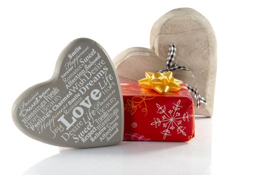 res present and wooden heart shapes for mothers day or valentines with love