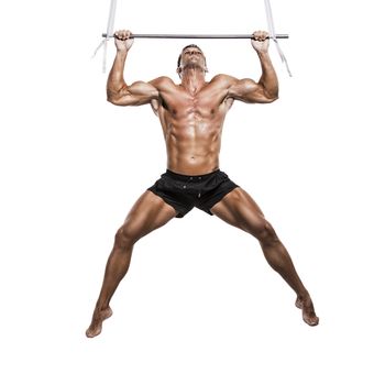 Muscle man making elevations, isolated over a white background