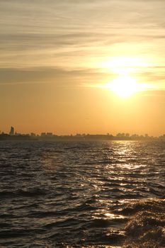 A sunset over the Rio de la Plata with the City of Buenos Aires in the background.
