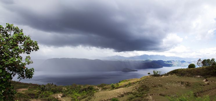 Rainfall over Lake Toba. Island on North Sumatra, Indonesia.