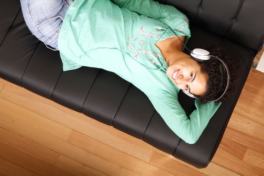 A jung brazilian woman relaxing on the sofa.