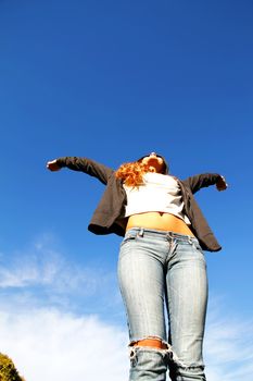 A young woman jumping in the Park.