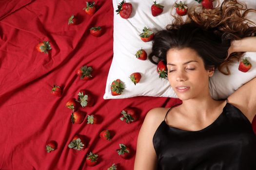 A young adult american woman dreaming of strawberries.