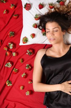 A young adult american woman dreaming of strawberries.