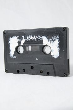 Ancient Vintage Used Musicassette over a White Background