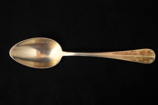 Ancient Vintage Silver Flatware on a Black Background