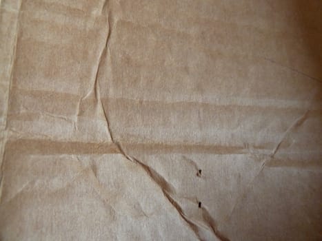 Rough creased brown paper surface