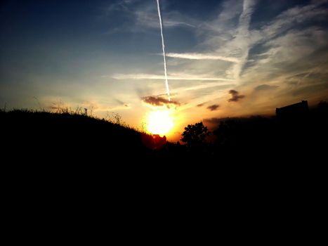 Bright sun with silhouette foreground