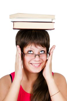 young beautiful girl in glasses with books on head. isolated on white background
