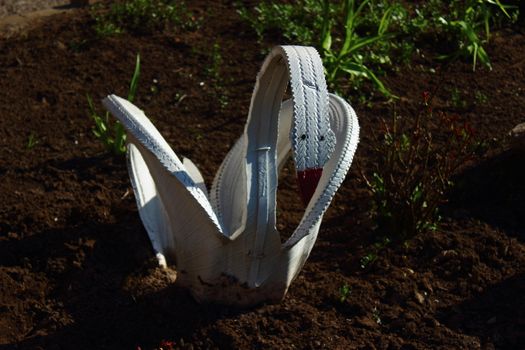 Decoration for a bed of tires on wheels in the form of a swan