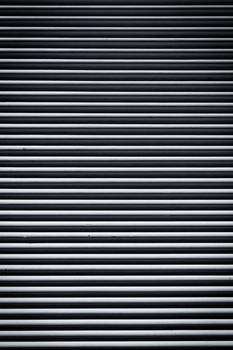 Striped gray concrete wall as a background texture