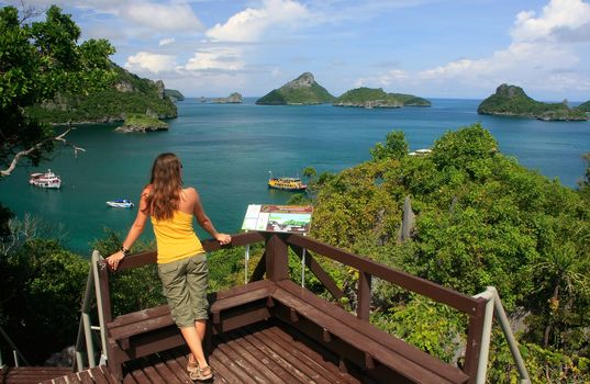 Young woman standing at overlook, Mae Koh island, Ang Thong National Marine Park, Thailand