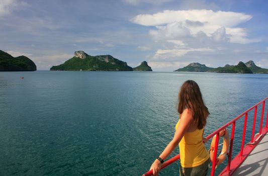 Young woman admiring scene from a boat, Ang Thong National Marine Park , Thailand