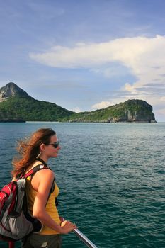 Young woman admiring scene from a boat, Ang Thong National Marine Park , Thailand