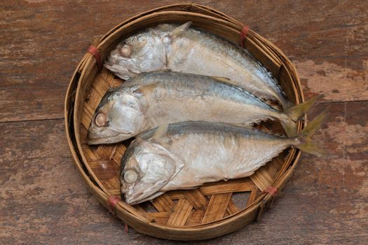 Mackerel fish in bamboo basket