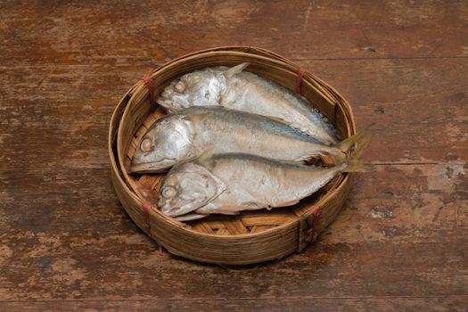 Mackerel fish in bamboo basket