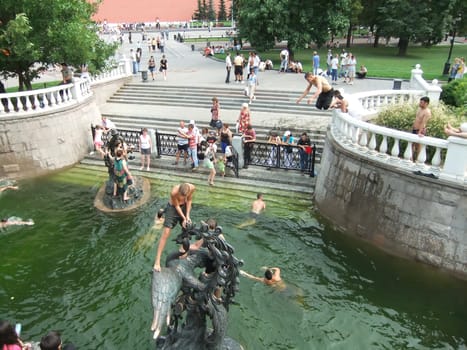 People swimming in a fountain, Alexander Gardens, Moscow, Russia