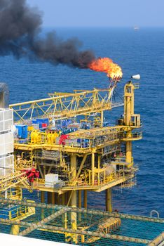 The gas flare is on the offshore oil rig platform