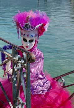 Pink and white person at the 2014 venetian carnival of Annecy, France