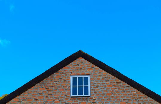 The roof of the house under the sky.