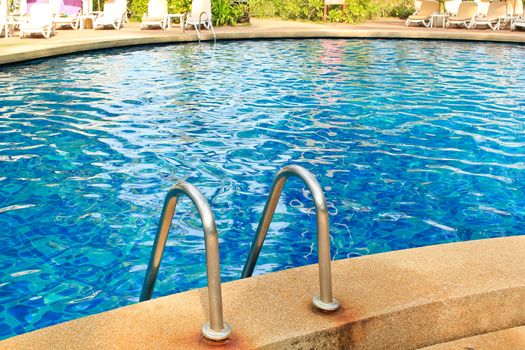 blue water swimming pool in Thai resort