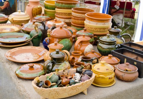 rustic handmade ceramic clay brown terracotta ware souvenirs at street handicraft market