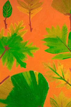 Wall paintings is painted green leaves with orange background.