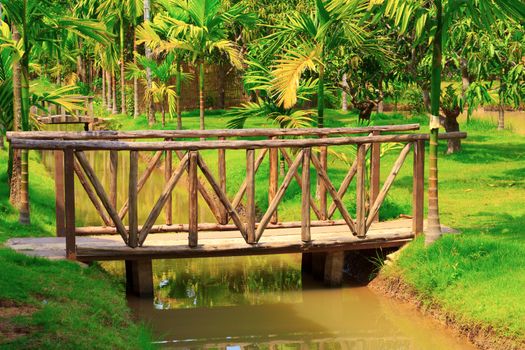 Old wooden bridge in garden, Chachoengsao province in thailand.