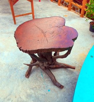 Genuine teak table with roots attached.