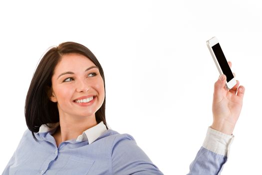 Portrait of young smiling brunette woman taking a selfie