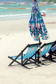 Beach chair a lot on the beach.