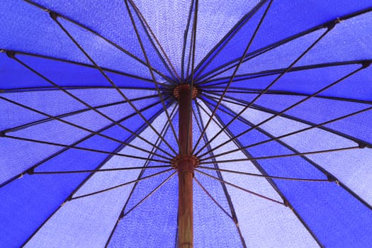 Close-up to the beach umbrella on the beach.