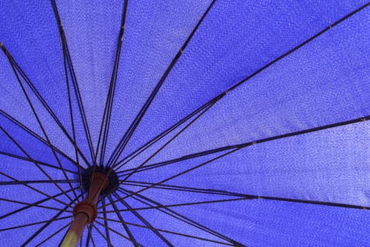 Close-up to the beach umbrella on the beach.