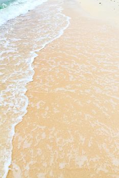 Soft wave of the sea on the sandy beach 