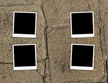 Blank instant photo frames on old brick floor and small cracks. 