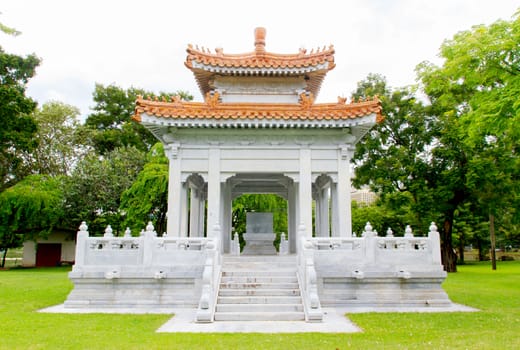 Chinese pavilion under blue sky in thailand.