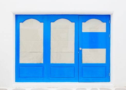 Blue elegant entrance door with white wall.