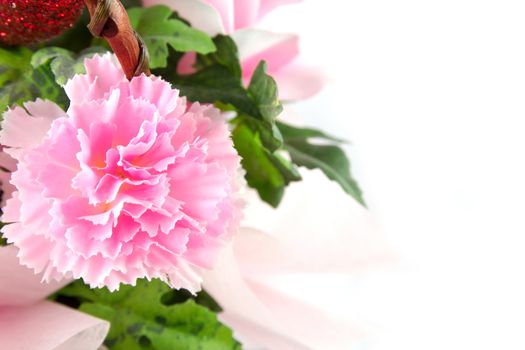 Pink fake flowers is isolated on a white.