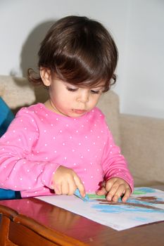 a child drawing at home