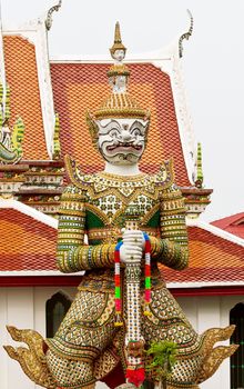 Giant guardian statue at the Temple of Dawn or Wat Arun.