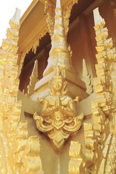 Statue of golden guardian at Wat Paknam Joelo in Chachoengsao province at thailand.