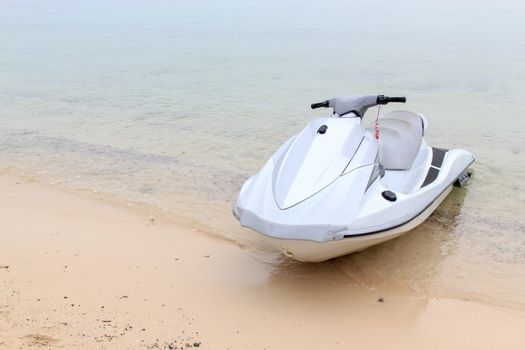 The jet ski parked on the beach.