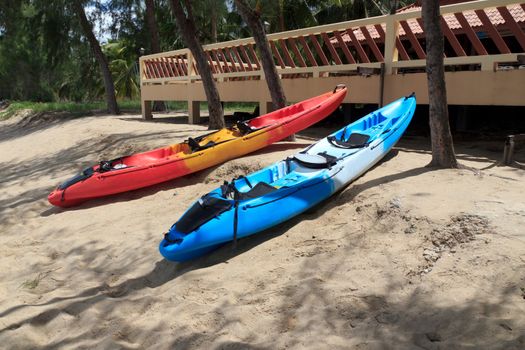 Colourful kayaks on tropical beach at BaanKrood, thailand.
